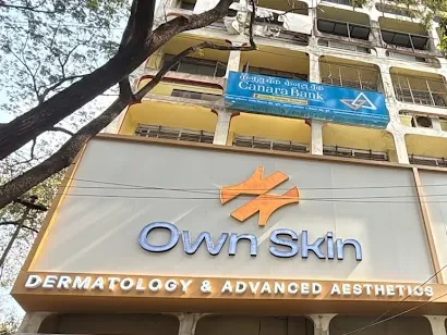 Own Skin Dermatology & Advanced Aesthetics signboard on MG Road, Camp, Pune